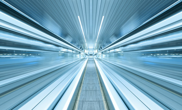 futuristic escalator inside contemporary airport