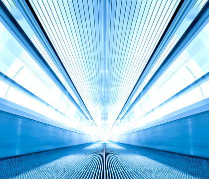 perspective escalator inside contemporary airport