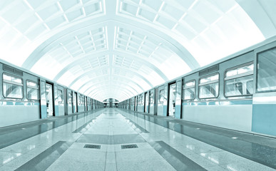 symmetric illuminated metro station with marble floor