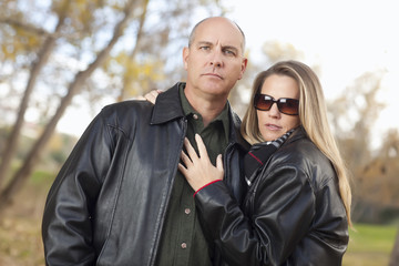 Attractive Couple in Park with Leather Jackets