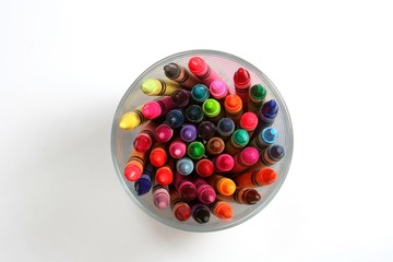 Top view of crayons in a glass