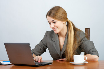 Young female executive working on laptop