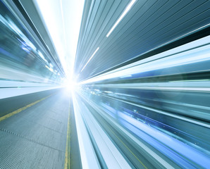 colorful diminishing moving escalator in office center