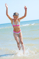 Happy Pretty beautiful girl running on beach