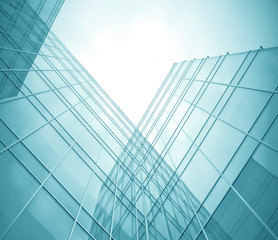 Fototapeta na wymiar contemporary transparent textured wall of glass skyscraper in bu