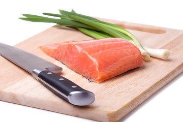 salmon pieces on a chopping board