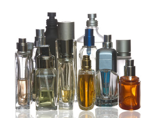 Colorful perfume bottles with reflection