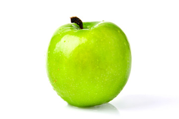 A beautiful green apple isolated on the white background.