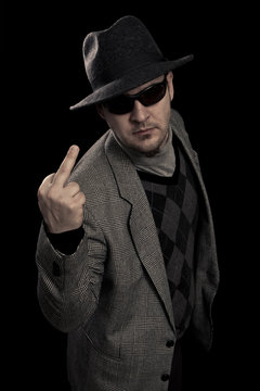 Man with suit, hat and sunglasses