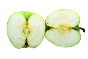 Two pieces green apple isolated on white background.
