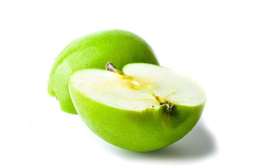 Two pieces green apple isolated on white background.