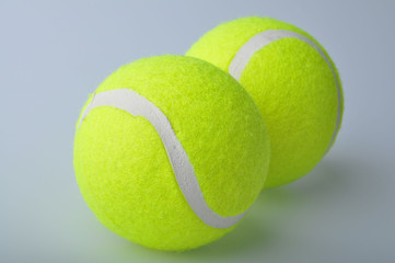 Two tennis balls isolated on the white background.