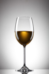 White wine in the glass on white