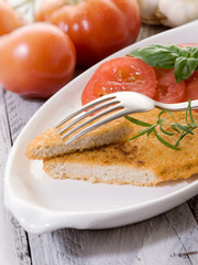 slice vegetarian cutlet with slice tomatoes