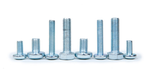 Small and big stainless steel screws isolated