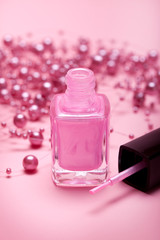 Obraz na płótnie Canvas Pink nail polish on pink background