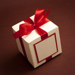 gift box tied with a red ribbon bow