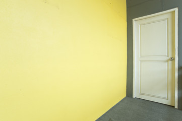 White door and yellow wall