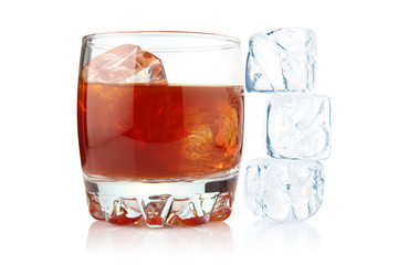 Glass of whiskey with ice cubes isolated