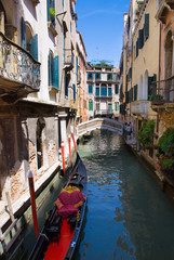 Fototapeta na wymiar Venice canal with gondola, Italy