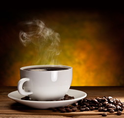 Cup of coffee with coffee beans