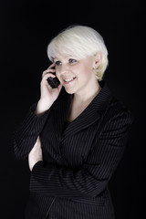 Attractive business woman talking on mobile phone - 31607175