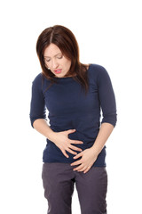 Obraz premium Woman holding her stomach