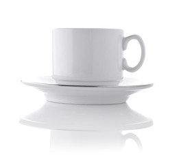 white ceramic cup on saucer
