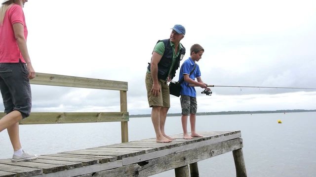 Family fishing on a pontoon