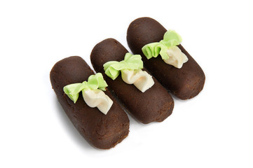 Three chocolate cake with rosettes isolated
