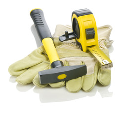 Fototapeta premium gloves with hammer and measuring tape