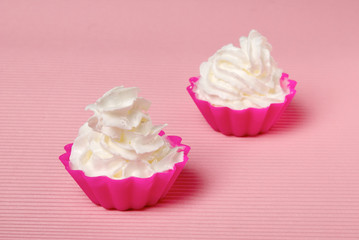 Two portions of whipped cream