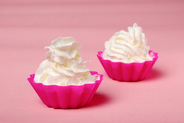 Two portions of whipped cream