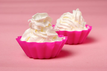 Two portions of whipped cream