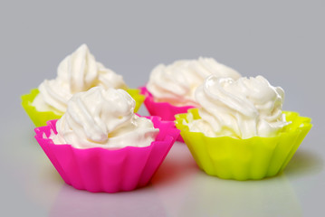 Four portions of whipped cream