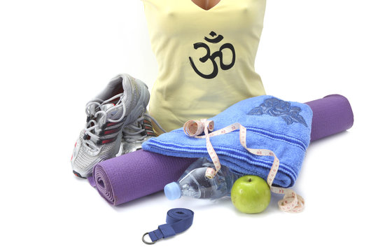 Mannequin, yoga mat,belt and towel on white