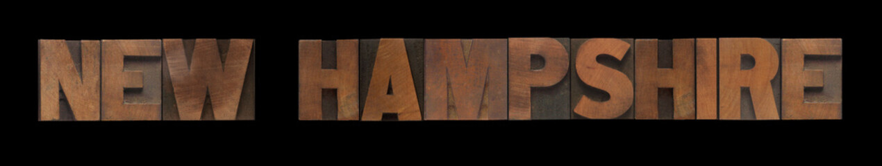 the words New Hampshire in old wood type