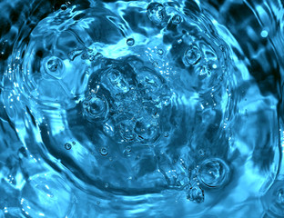 texture of blue water with bubbles and drops