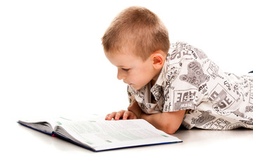 Cute boy reading a book