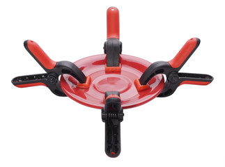 Four clamps tearing empty plate