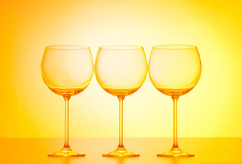 Wine glasses against gradient background