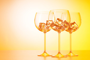 Glasses of water against gradient background