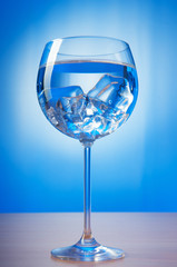 Water in the glass against gradient background