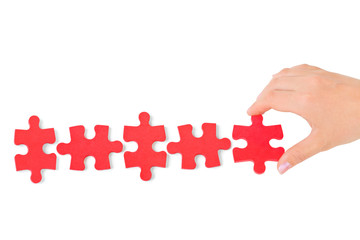 Hand and puzzle
