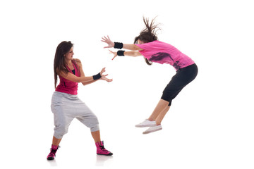 stylish female dancers making a breakdance move