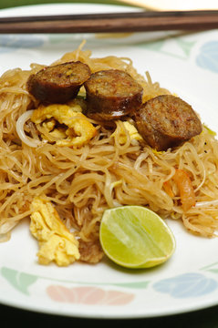 Stir fried noodle Thai style with Thai sausages