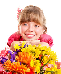 Happy child holding flowers.