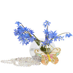 Bluebell bouquet in a vase clear with beads and a butterfly