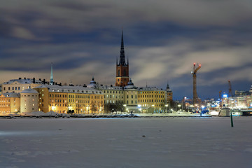 Fototapeta premium Evening view of Riddarholmen island and Gamla Stan in Stockholm