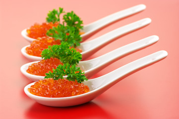 Salmon caviar in spoons